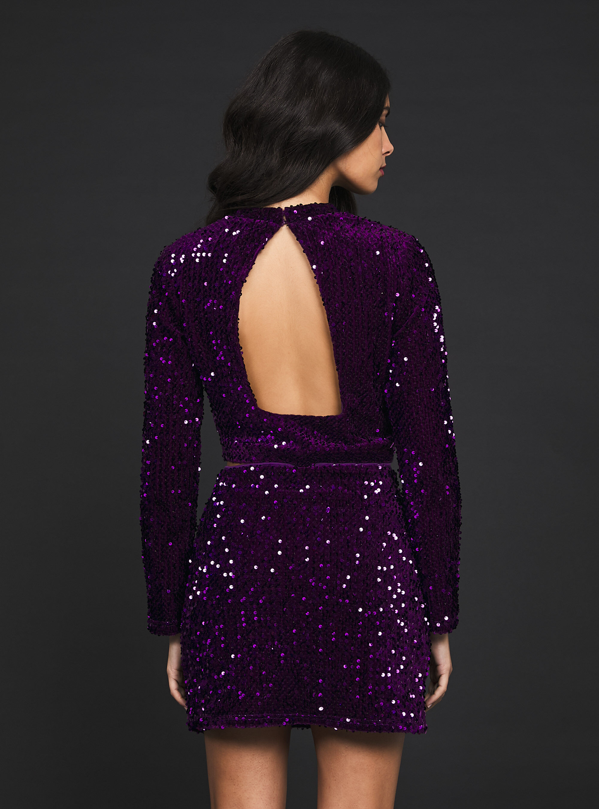 Top a maniche lunghe con paillettes