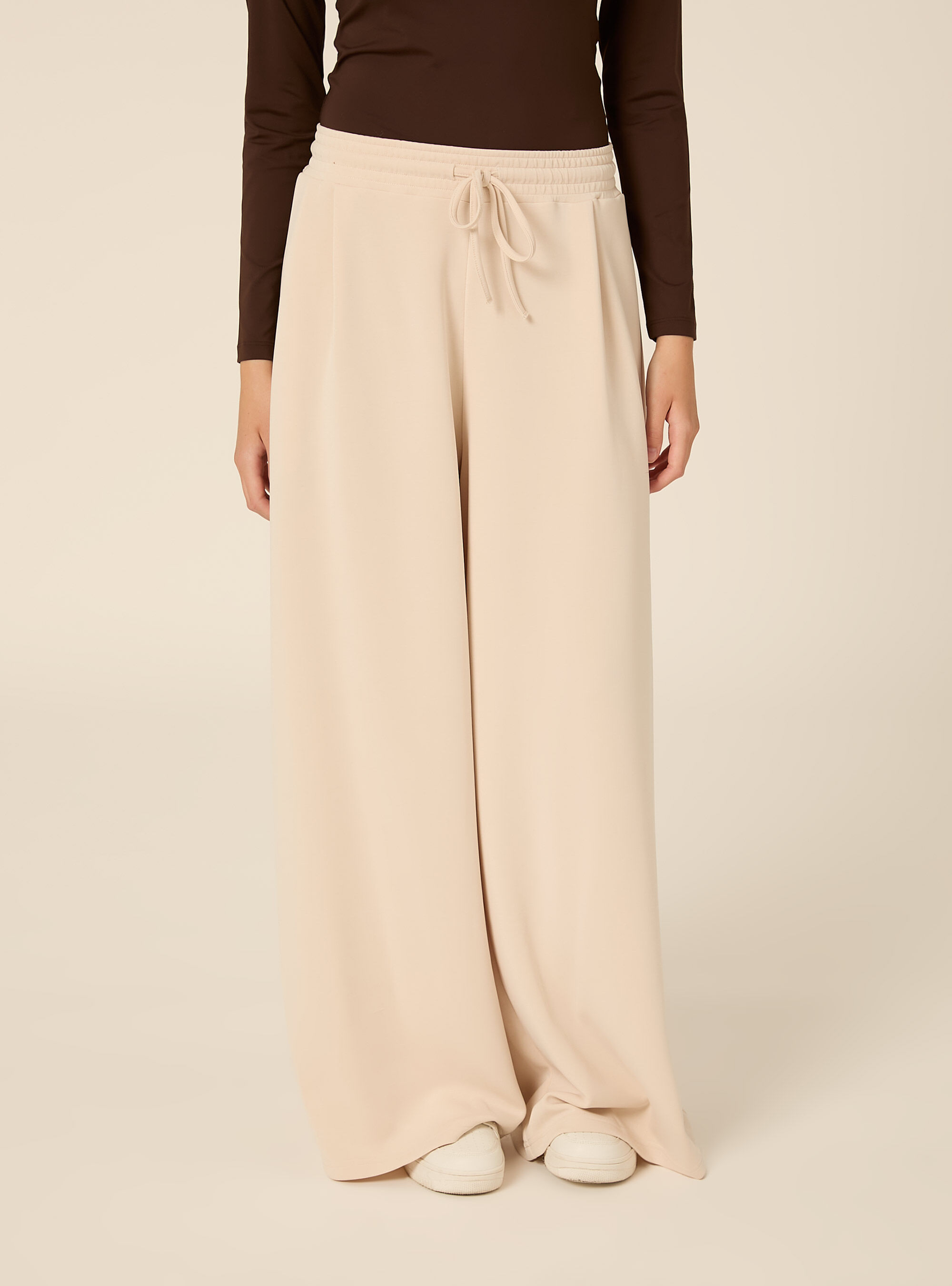 Pantaloni wide leg con pence in scuba