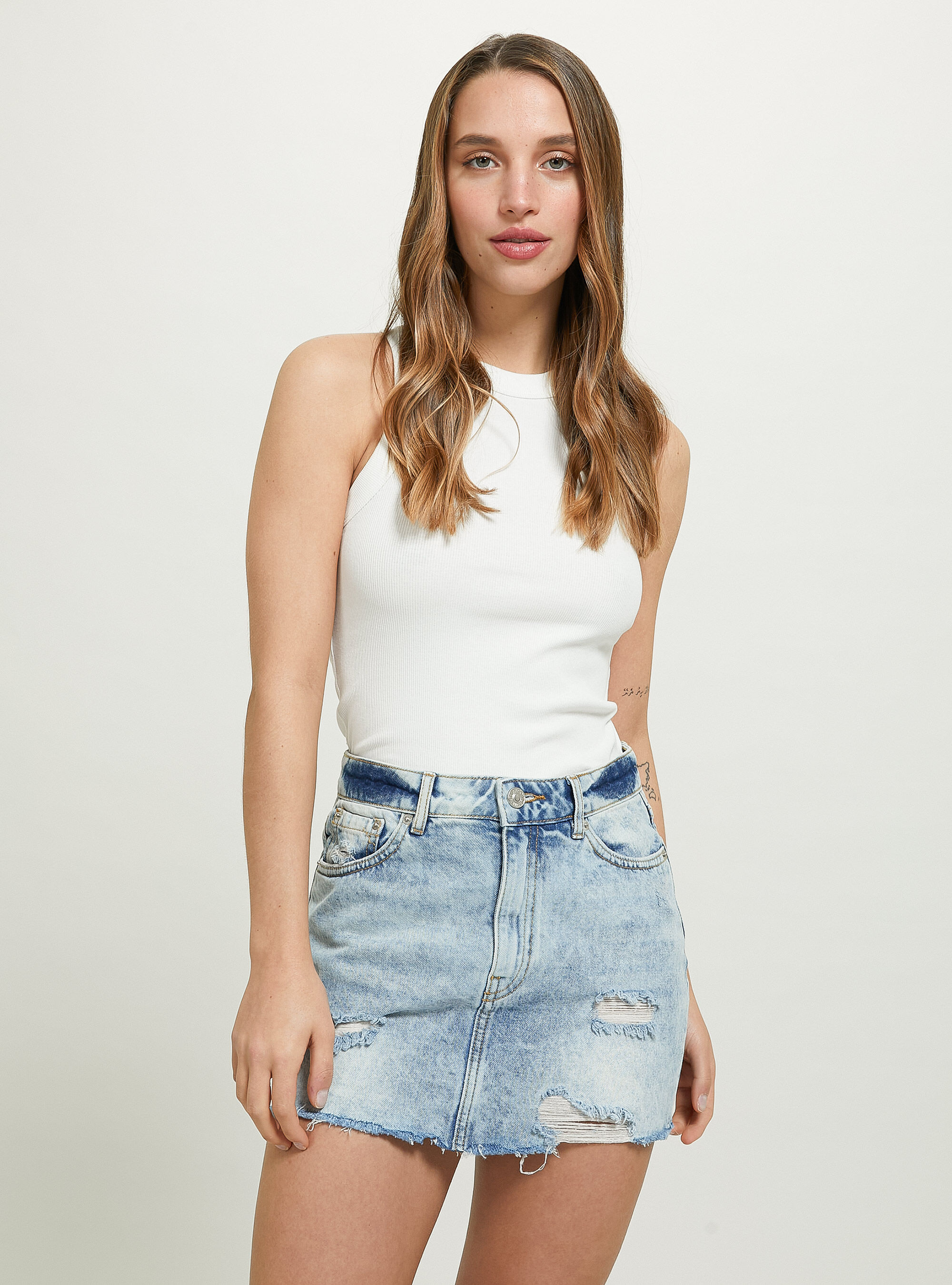 Blue jean skirt with rips sales