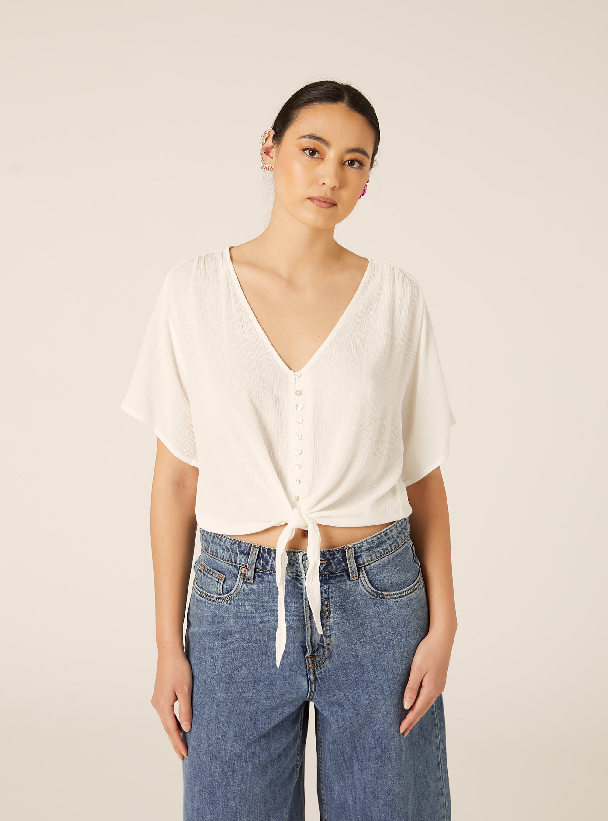 Solid color V-neck shirt with tie-waist