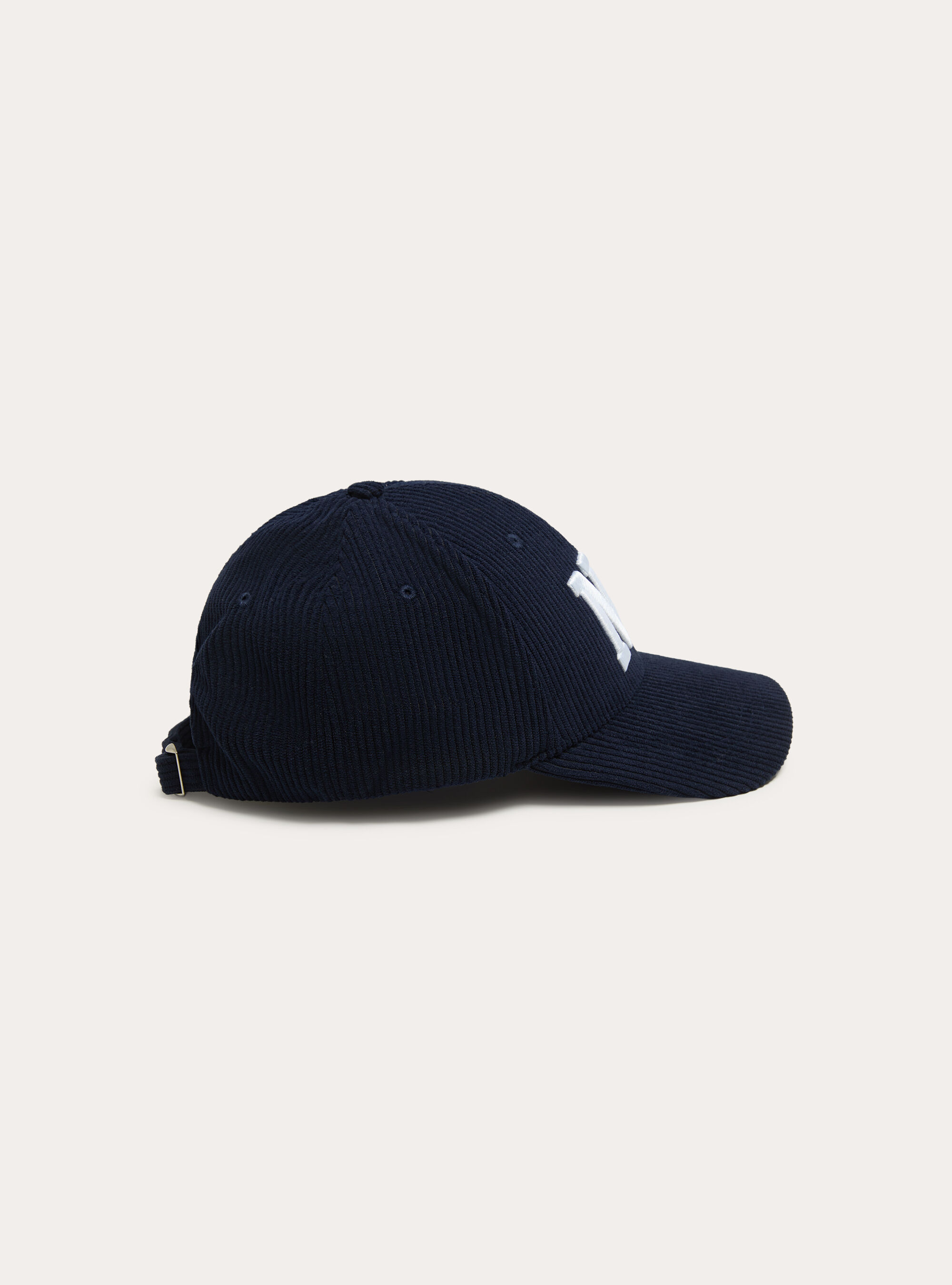 Cappello con visiera e ricamo in velluto a coste
