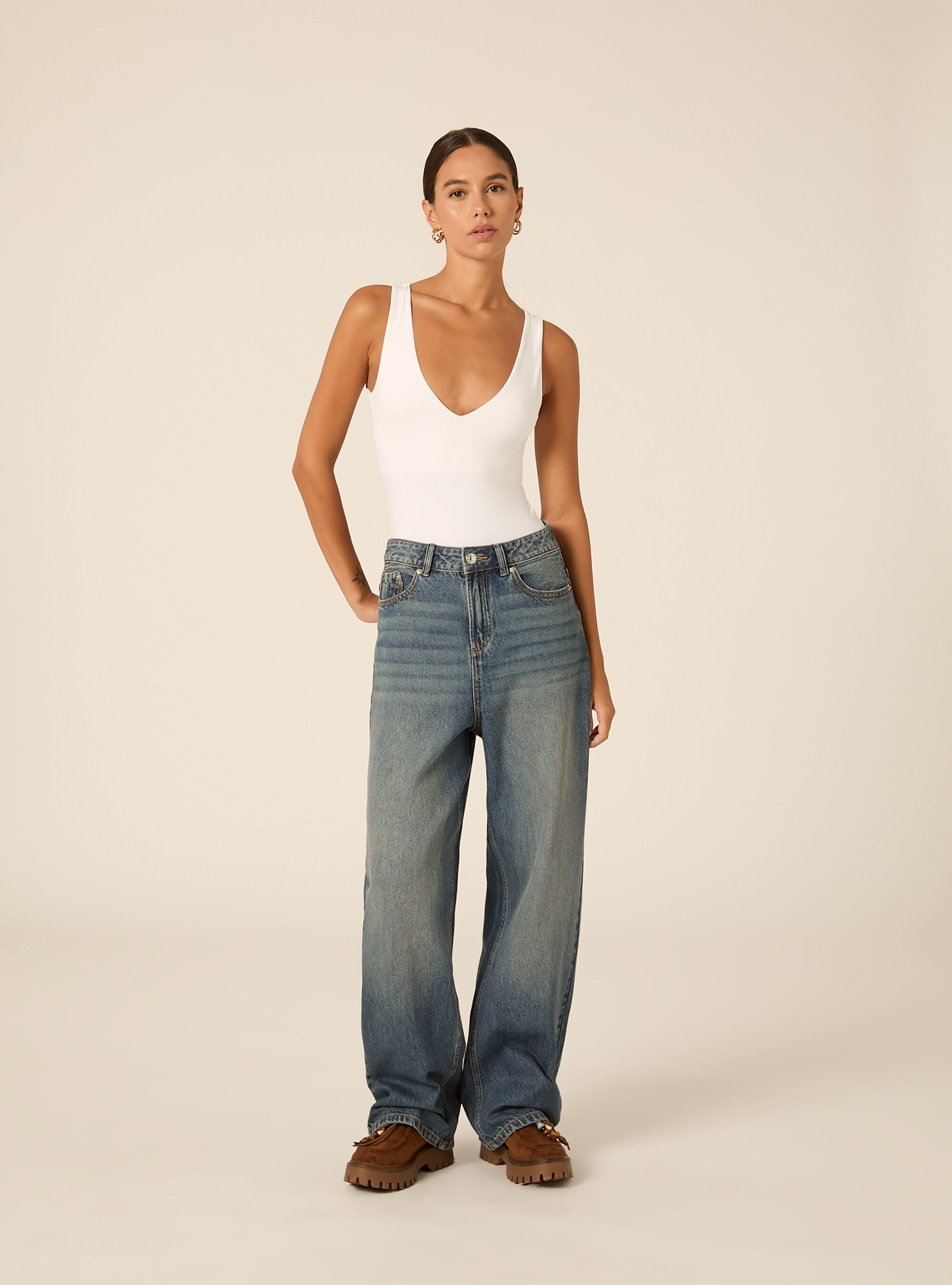Sleeveless stretch fabric bodysuit with v neck