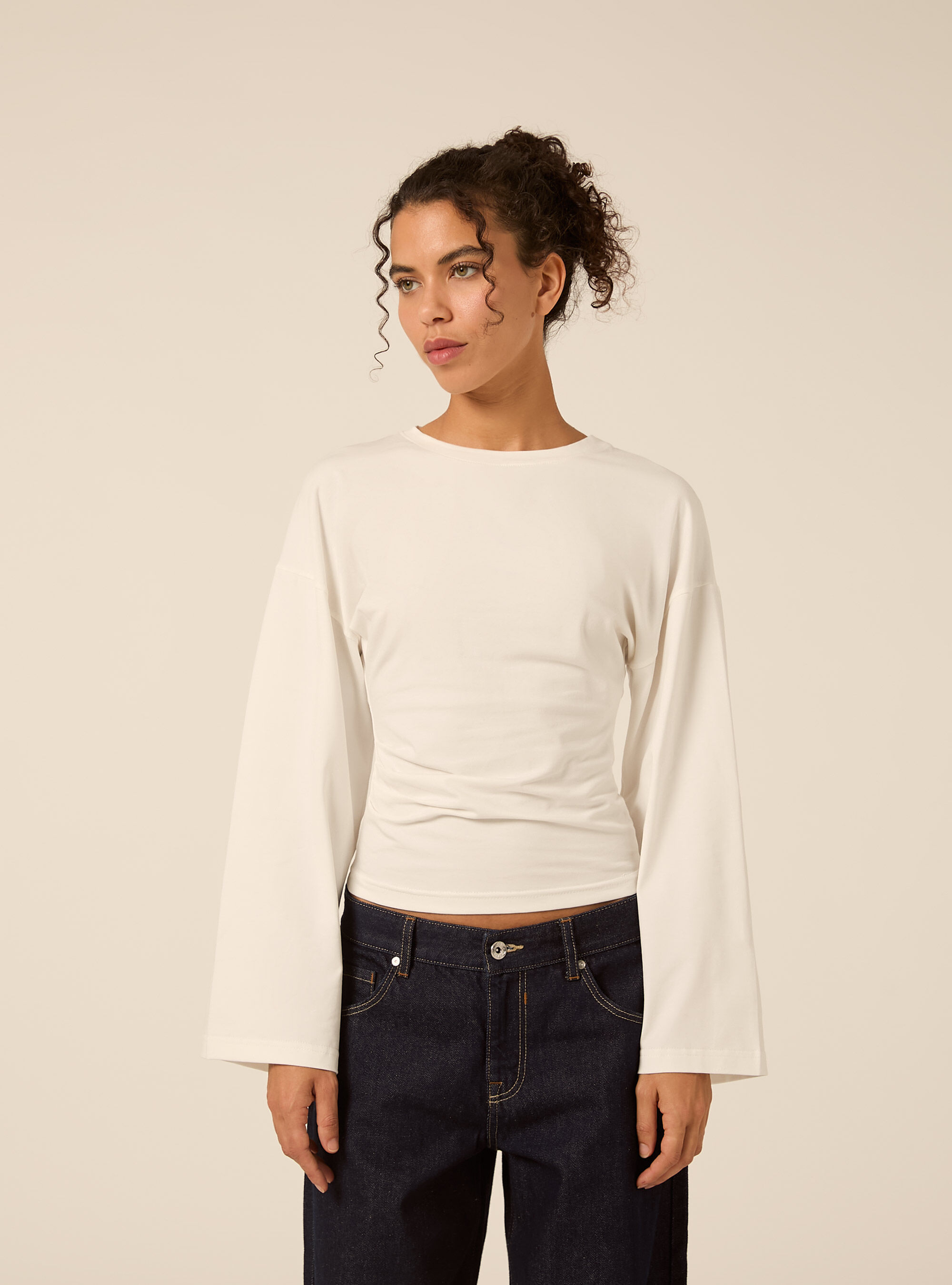 Flare sleeve top with side ruched detailing