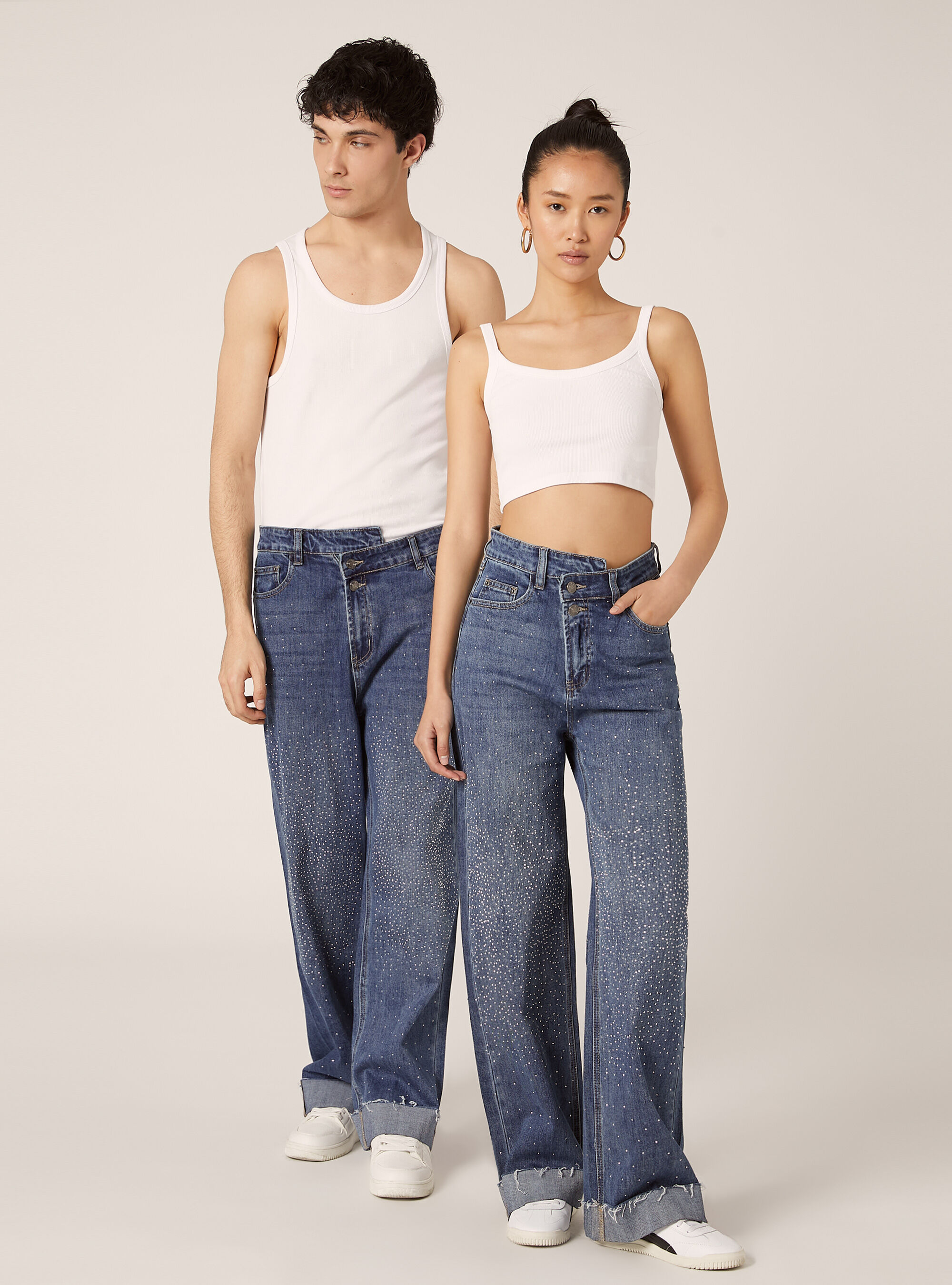 Wide leg jeans with rhinestones and asymmetric waistband
