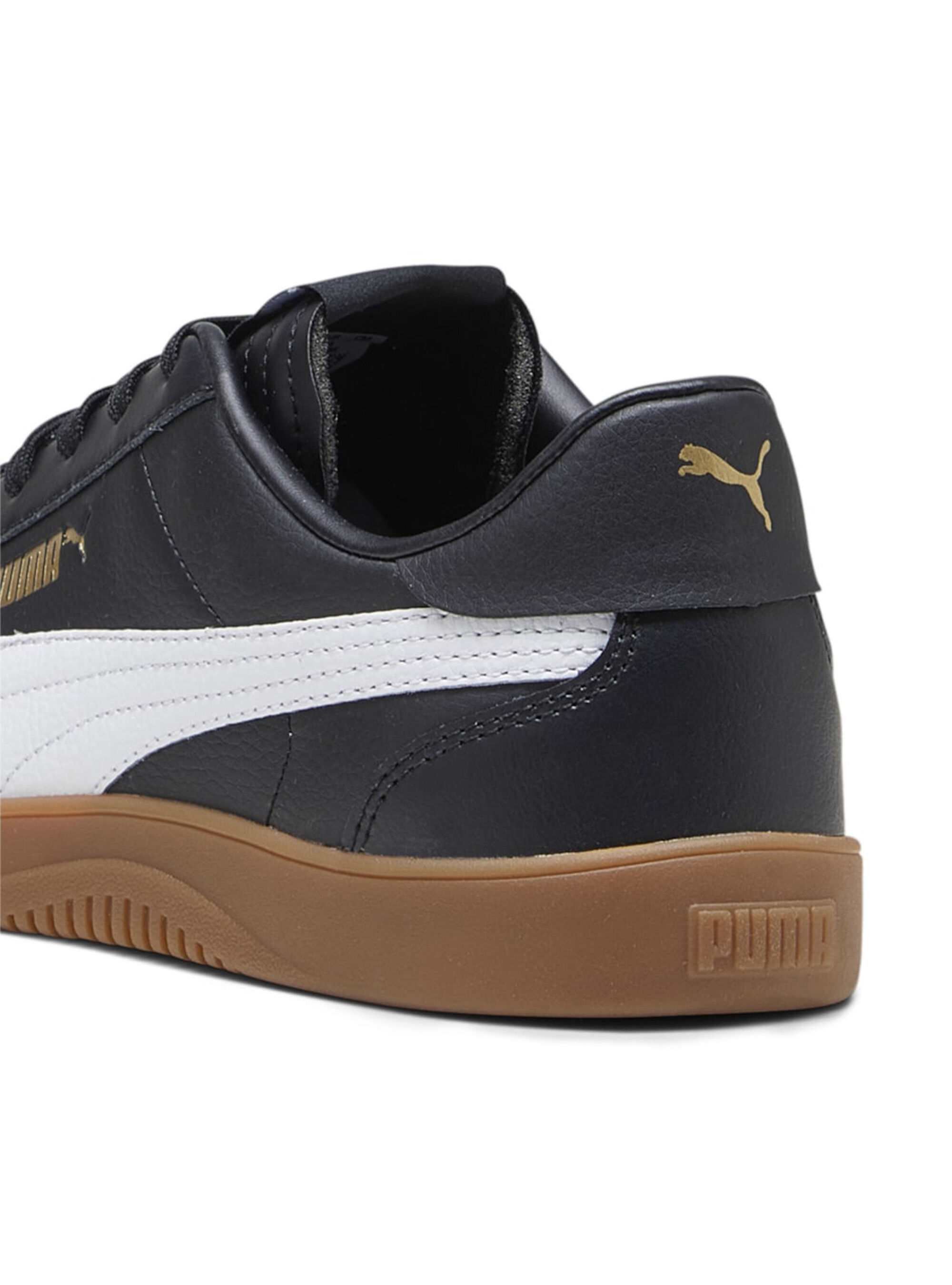 black white and gold pumas