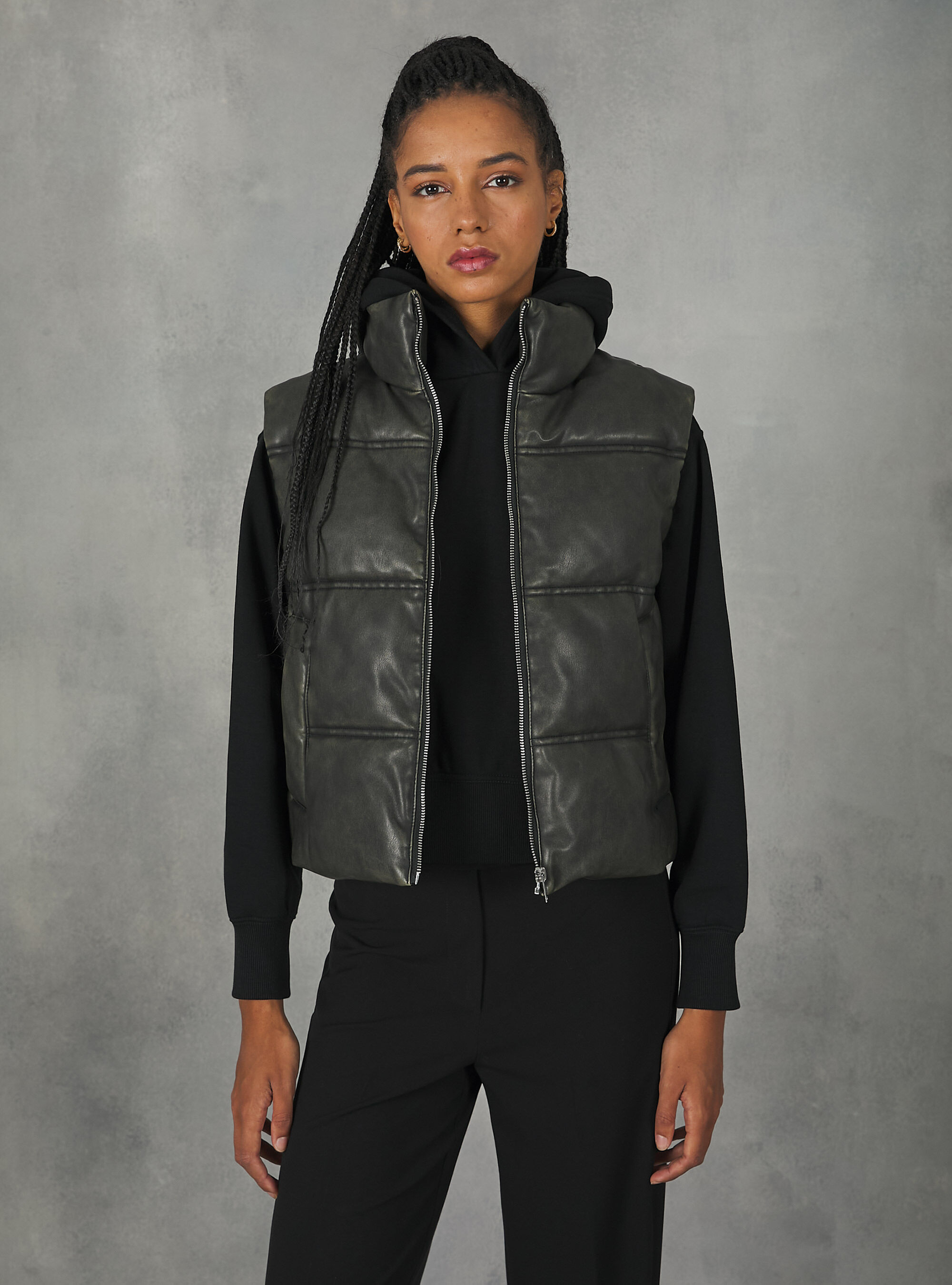 Leather effect sleeveless jacket with recycled padding