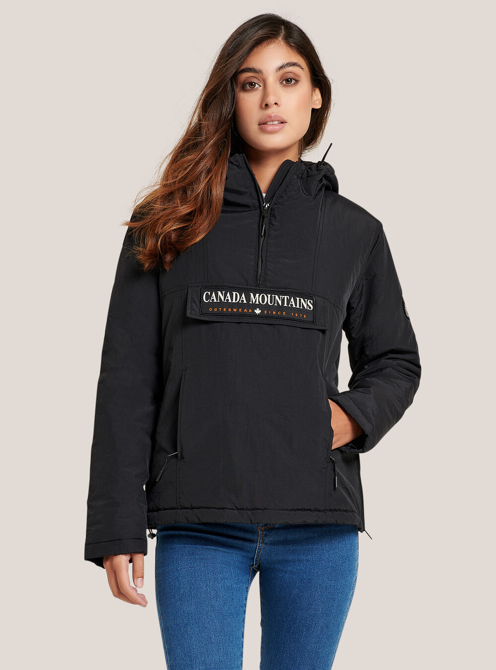Anorak jacket with front flap with patch and hood