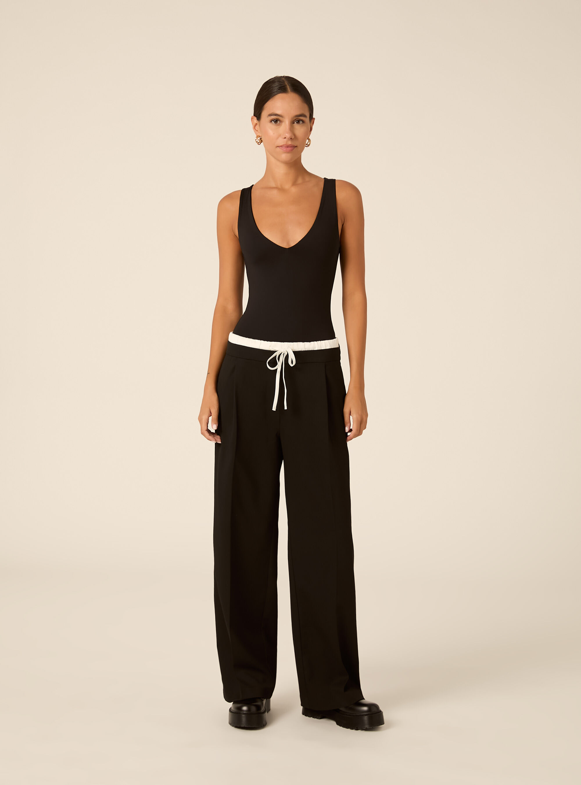 Sleeveless stretch fabric bodysuit with v neck