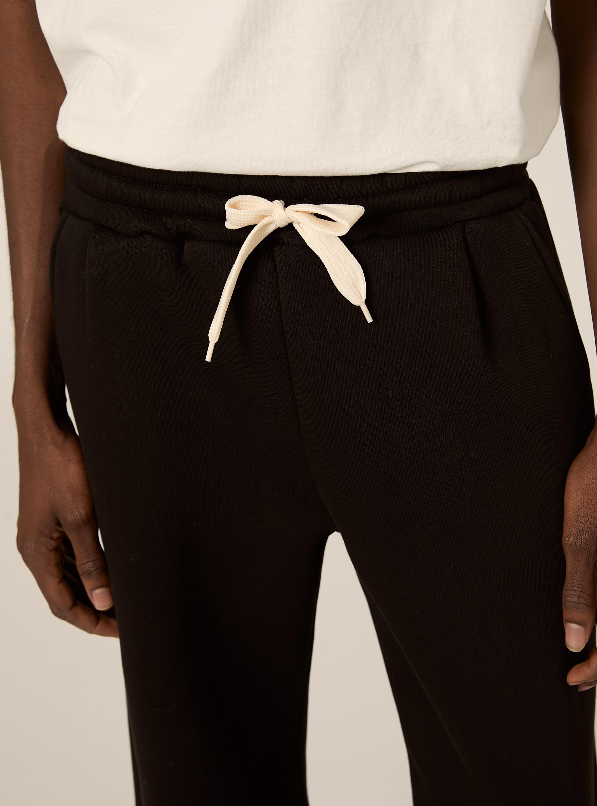 Jogger con cerniera al fondo, BK1 BLACK