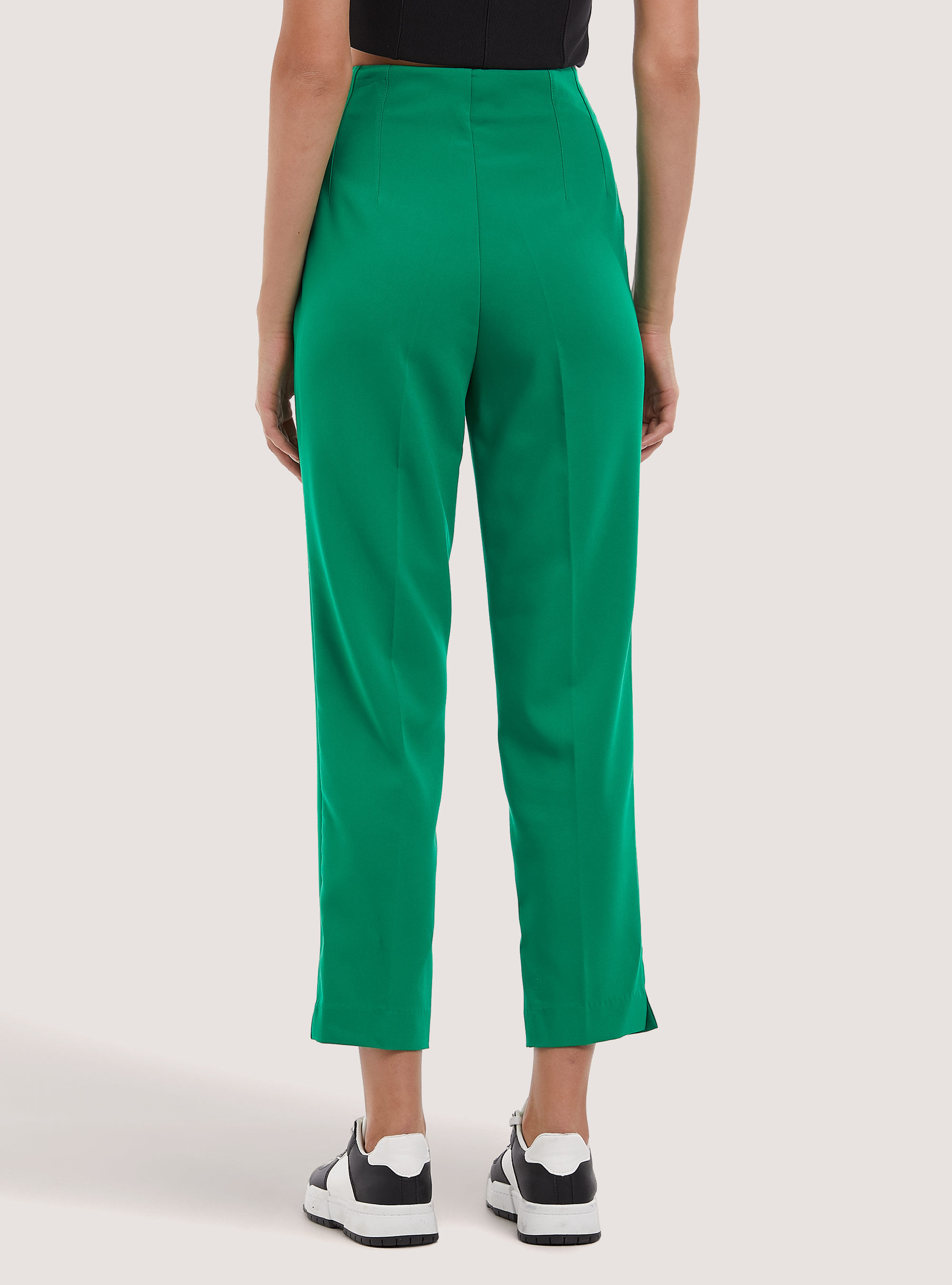 Plain coloured trousers with darts