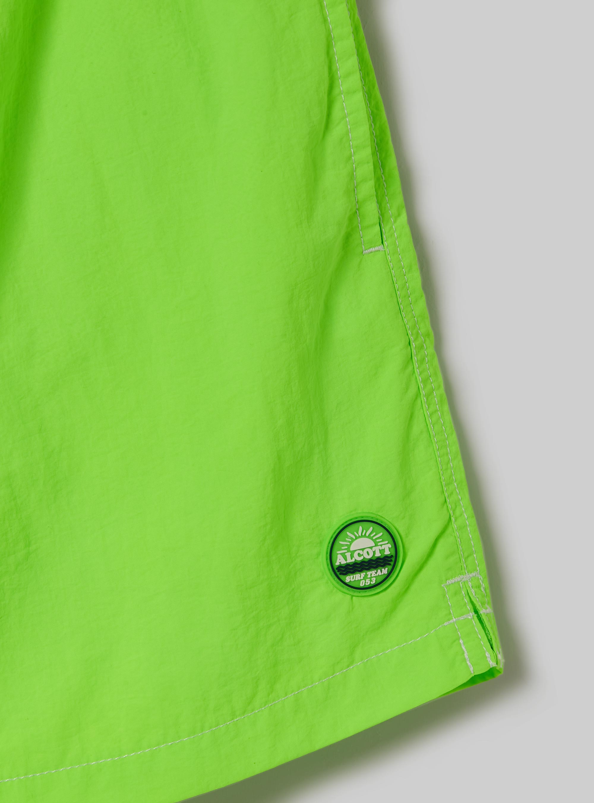 Costume tinta unita con ricamo e tasca sul retro, FGN3 FLUO LIGHT GREEN